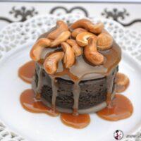 How to Make Chocolate Meringue Brownies with Cashew Caramel Sauce lizbushong.com, rich decadent brownie round sandwiched between two chocolate meringues topped with cashew caramel sauce.